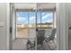Screened balcony with seating and scenic community views at 332 Kiskadee Loop # L, Conway, SC 29526
