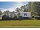 Single-story home with covered porch and landscaping at 527 Folly Estates Dr., Myrtle Beach, SC 29588
