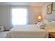 Spacious bedroom with large window and soft bedding at 527 Folly Estates Dr., Myrtle Beach, SC 29588