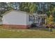 Single-wide mobile home with brick skirting and a covered porch at 527 Folly Estates Dr., Myrtle Beach, SC 29588