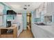 White kitchen features stainless steel appliances and light wood flooring at 6001 - 1749 S Kings Hwy., Myrtle Beach, SC 29575