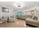 Living area with beige sectional and an open floor plan at 6001 - 1749 S Kings Hwy., Myrtle Beach, SC 29575