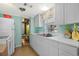 Kitchen with white cabinets, stainless steel appliances, and a view into a bedroom at 6001 - 1749 S Kings Hwy., Myrtle Beach, SC 29575