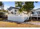 Elevated deck with white railings overlooks a grassy area at 6001 - 1749 S Kings Hwy., Myrtle Beach, SC 29575