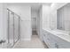 Double vanity bathroom with walk-in shower at 8605 Pinnacle Cove Way, Longs, SC 29568