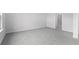 Well-lit bedroom with grey carpet and ensuite bath at 8605 Pinnacle Cove Way, Longs, SC 29568