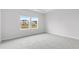 Spacious bedroom with carpeted floors and a window at 8605 Pinnacle Cove Way, Longs, SC 29568