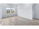 Bright bedroom with hardwood floors and large windows at 8605 Pinnacle Cove Way, Longs, SC 29568