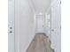 Light and airy hallway with wood-look flooring at 8605 Pinnacle Cove Way, Longs, SC 29568