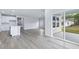 Open concept kitchen and living area with island at 8605 Pinnacle Cove Way, Longs, SC 29568