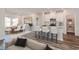 Open concept kitchen with island and white cabinets at 8605 Pinnacle Cove Way, Longs, SC 29568