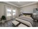 Spacious primary bedroom with plush carpeting and large windows at 8605 Pinnacle Cove Way, Longs, SC 29568