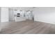 Open concept living space with hardwood floors and kitchen views at 8605 Pinnacle Cove Way, Longs, SC 29568