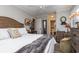 Spacious main bedroom with a ceiling fan and plush bedding at 118 Salt Marsh Circle # 25-I, Pawleys Island, SC 29585