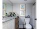 Clean bathroom with granite vanity and wicker storage at 118 Salt Marsh Circle # 25-I, Pawleys Island, SC 29585