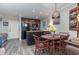 Eat-in kitchen with dark wood cabinets, granite counters, and a round dining table at 118 Salt Marsh Circle # 25-I, Pawleys Island, SC 29585