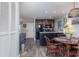 Eat-in kitchen with dark wood cabinets and granite countertops, round dining table at 118 Salt Marsh Circle # 25-I, Pawleys Island, SC 29585