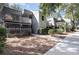 Two-story building exterior with walkway and landscaping at 118 Salt Marsh Circle # 25-I, Pawleys Island, SC 29585