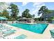 Community pool with lounge chairs and nearby restrooms at 118 Salt Marsh Circle # 25-I, Pawleys Island, SC 29585