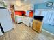 Small kitchen with white appliances and orange accents at 6001 - M26 S Kings Hwy., Myrtle Beach, SC 29575