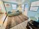Living room featuring a teal couch and decorative pillows at 6001 - M26 S Kings Hwy., Myrtle Beach, SC 29575