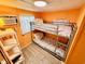 Small bedroom with a bunk bed and orange walls at 6001 - M26 S Kings Hwy., Myrtle Beach, SC 29575