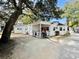 Charming white cottage with porch and fenced yard at 6001 - M26 S Kings Hwy., Myrtle Beach, SC 29575