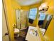 Small bathroom with a shower/tub combo and yellow walls at 6001 - M26 S Kings Hwy., Myrtle Beach, SC 29575