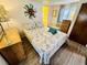 Bedroom with a seashell-themed bedspread and wooden dresser at 6001 - M26 S Kings Hwy., Myrtle Beach, SC 29575