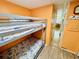 View down a hallway, with bunk beds on one side and kitchen in the distance at 6001 - M26 S Kings Hwy., Myrtle Beach, SC 29575