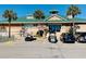 Exterior view of community center with golf cart parking at 6001 - M26 S Kings Hwy., Myrtle Beach, SC 29575