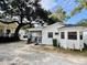 White cottage with a porch, grill and side yard at 6001 - M26 S Kings Hwy., Myrtle Beach, SC 29575
