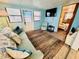 Living room with teal couch and view of bedroom at 6001 - M26 S Kings Hwy., Myrtle Beach, SC 29575