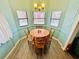 Cozy dining area with a round table and four chairs at 6001 - M26 S Kings Hwy., Myrtle Beach, SC 29575
