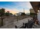 Deck with rocking chairs and sunset view at 3801 N Ocean Blvd., North Myrtle Beach, SC 29582