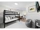 Bunk beds and a sitting area in a well-lit bedroom at 3801 N Ocean Blvd., North Myrtle Beach, SC 29582