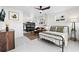 Open bedroom with queen bed, bunk beds, and living area at 3801 N Ocean Blvd., North Myrtle Beach, SC 29582
