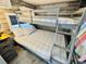 Bunk beds with striped bedding and additional window at 6001 - 1781 S Kings Hwy., Myrtle Beach, SC 29575