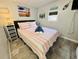 Bedroom with striped bedding and beach-themed decor at 6001 - 1781 S Kings Hwy., Myrtle Beach, SC 29575