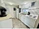 Well-equipped kitchen featuring white appliances and mosaic backsplash at 6001 - 1781 S Kings Hwy., Myrtle Beach, SC 29575