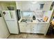 Bright kitchen with white cabinets and a double sink at 6001 - 1781 S Kings Hwy., Myrtle Beach, SC 29575