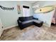 Living room with sectional sofa and surfboard decor at 6001 - 1781 S Kings Hwy., Myrtle Beach, SC 29575