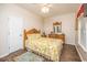 Cozy bedroom featuring a queen bed, a dresser, and hardwood floors at 6001 - 1123 S Kings Hwy., Myrtle Beach, SC 29575