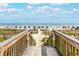 Wooden staircase leads to sandy beach with ocean view at 6001 - 1123 S Kings Hwy., Myrtle Beach, SC 29575