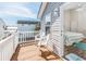 Deck with white railing, two chairs, and access to bedroom at 6001 - 1123 S Kings Hwy., Myrtle Beach, SC 29575
