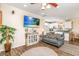 Bright living room featuring hardwood floors, comfy sofas, and a large TV at 6001 - 1123 S Kings Hwy., Myrtle Beach, SC 29575