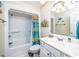 Bathroom with shower/tub combo, white vanity, and beach-themed decor at 6001 - 1123 S Kings Hwy., Myrtle Beach, SC 29575