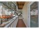 Private deck with wooden flooring and white railing, overlooking neighboring houses and trees at 6001 - 1123 S Kings Hwy., Myrtle Beach, SC 29575