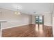 Spacious living room with hardwood floors, water views, and sliding glass doors at 336 Kiskadee Loop # B, Conway, SC 29526