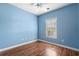 Light blue bedroom with wood flooring and window at 336 Kiskadee Loop # B, Conway, SC 29526